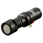 RØDE VideoMic Me-L iPhone Lightning mikrofonas su auksiniu jungtimi, raudonu mygtuku ir tinkleliu, ant švaraus balto fono.