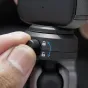 PGYTECH CapLock trijų rankų vakuuminis laikiklis su reguliuojamu saugos užraktu, artimu planu matomas juodas korpusas, dviguba kamuolys ir nykščio varžtas.
