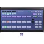 Skaarhoj Air Fly Controller for vMix Systems - Artimas vaizdas su mėlynu priekiu, kuriame yra mygtukai, LED indikatoriai ir perėjimo faderis, su apšviestais mygtukais žalia, raudona ir purpurine spalvomis, ir prekės ženklo pavad