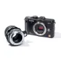 Metabones ALPA į Micro Four Thirds adapteris juodas matinis, su varinio vidinio siūlo mechanizmu, išdėstytas kartu su Panasonic Lumix GF1 fotoaparatu, skirtas preciziškai prijungti objektyvus