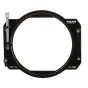 Tilta MB-T12-136 136mm objektyvų adapteris, viršūnės vaizdas su raktinės formos įlankiu ir gumbeliais, skirtais saugiai pritvirtinti matavimo dėžutę