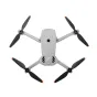 DJI Lito X1 bepilotis orlaivis viršuje, su išskleistais juodais propeleriais ir oranžinėmis galvutėmis, rodančiu kompaktišką sulankstomą dizainą ir centrinį kamerų gimbal apsaugą