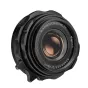 Thypoch DZO Ksana 21mm f/3.5 ASPH platus kampas objektyvas su juodu objektyvo skydeliu Leica M montavimui, su Epoch Coating 73 kinematografiniais šviesos efektais