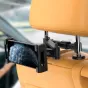 Tech-Protect planšetinio kompiuterio ir telefono automobilinis laikiklis, pritvirtintas prie šviesaus automobilio galvos atlošo, su reguliuojamomis spaustukais ir skaidriu apsauginiu rėmu, užtikrinančiu saugų horizontalią padėtį