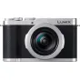 Panasonic Lumix L10 sidabrinė kompaktiška fotoaparatas su Leica 24-75 mm f/1.7-2.8 objektyvu priekinėje pusėje, aukštos kokybės konstrukcija su taktiliniais valdymo ratukais