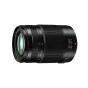 Panasonic Lumix G Vario 35-100mm F2.8 objektyvas, juodas, šoninis vaizdas su priartinimo žiedu, fokusavimo atstumo žymės 35-100mm, maitinimo jungiklis ON, raudonas taškas, priekinis elementas matomas