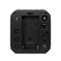 Apsukta Z CAM Z-CAM E2-S6G Super 35mm 6K kino kameros pusė, rodanti juodą tvirtą korpusą, kelis XLR ir BNC jungtis, HDMI prievadą, Ethernet lizdą ir akumuliatoriaus skyrių su auksiniais kontaktais.