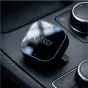 Tech-Protect CA01 bevielis CarPlay ir Android Auto adapteris, juodas matinės kvadratinės formos įranga su blizgiu viršumi, ant kurio matomas logotipas ir mėlynas LED indikatorius, padėtas ant automobilio centrinės konsolės šalia