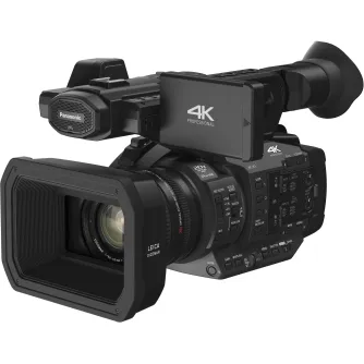 Juodas Panasonic HC‑X1 profesionalus 4K vaizdo kamera su Leica Dicomar 20× optiniu priartinimo objektyvu, 3,5 colių rotuojamu jutikliniu ekranu ir šoniniu valdymo pultu.