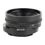 AstrHori MF 18 mm f/5.6 APS‑C šiftas objektyvas Sony E, kompakti pancake dizaino, priekinis stiklo elementas, šiftas su 0.3‑0.4 žymomis ir raudono trikampio indikatorius, rankinis fokusavimas, 36 mm gylis.