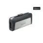 SanDisk Ultra Dual Drive USB‑C 32 GB su juodą tekstūru galine dalimi, šlifuota sidabrinė priekinė panelė su SanDisk logotipu, matomas USB‑C jungtis ir Android suderinamumo ženklelis