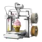 Creality SparkX i7 Nano Combo 3D printer su mulšiauva funkcija, rožinis glinas modelis išvažiavus į zelta būvės plokštą, du spinduliai filamentas (beige ir zelta) prie, ir aktyvus tactinis ekranas.